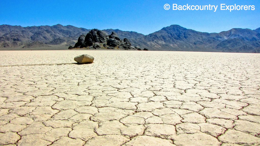 rock with tracks across the racetrack playa in Death Valley