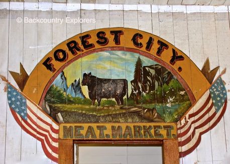Picture painted over the doorway of the meat market