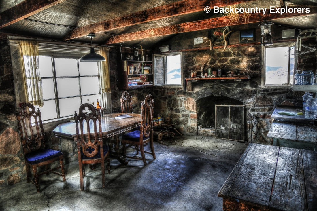Inside photo of fireplace in geologist cabin.