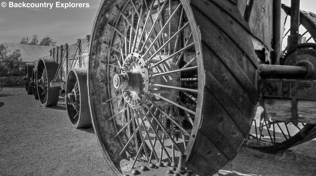 Black and white photo showing rear wheel 8 feet in diameter and 26 inches wide